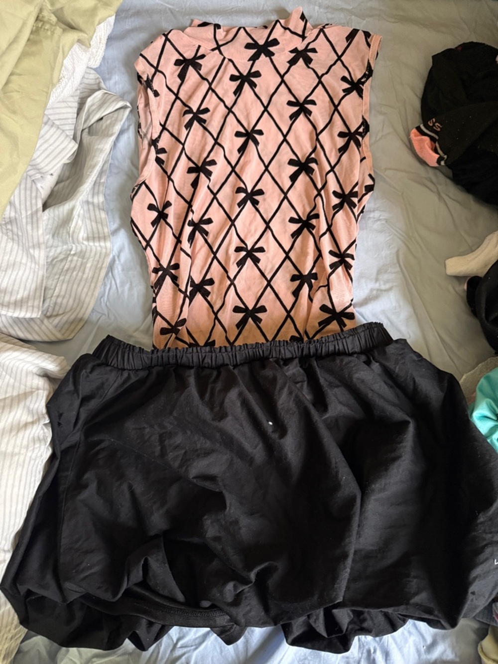 Rainbow Black Circle Skater Skirt with Pink Bow-Patterned Top.